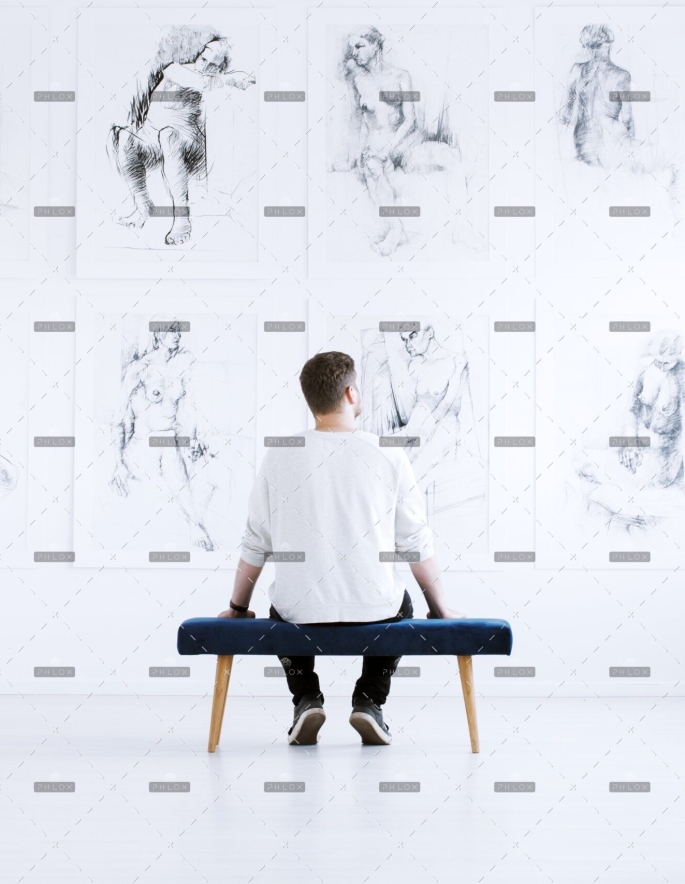 demo-attachment-218-man-relaxing-in-art-gallery-P9C4CGY-1